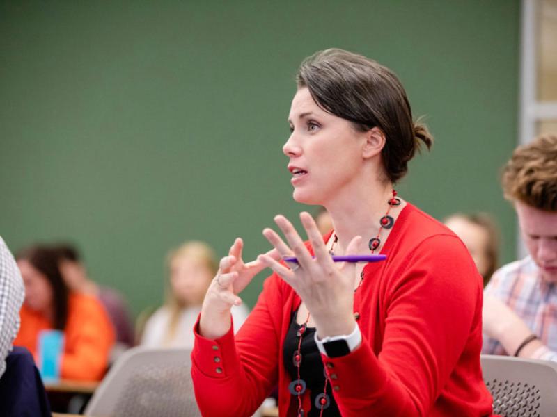 A female professor lectures during a College of Applied Health Sciences class in the Khan Annex.